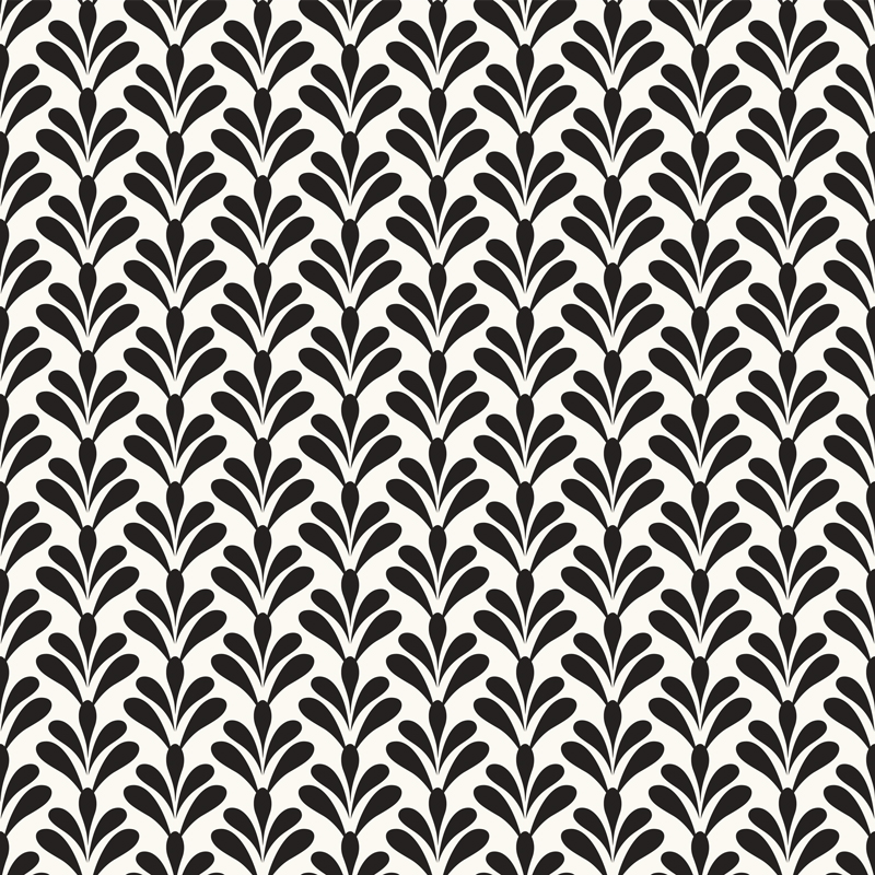 Czarne kępki liści na jasnym tle