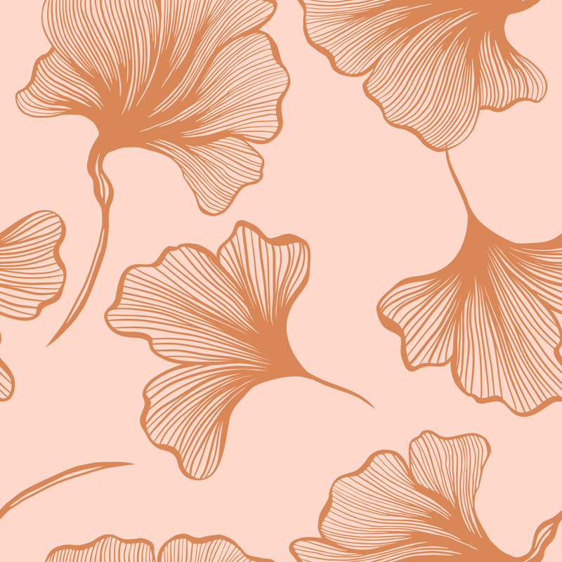 Duże, brązowe liście miłorzębu na różowym tle